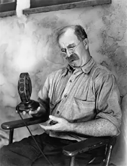 Mustaches: Man looking at a microphone