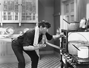 Grime: Man looking into oven