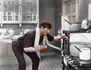 Grime: Man looking into oven