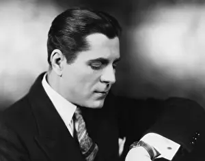 Wrists: Man looking at his watch