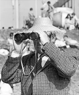Peers: Man looks through Binoculars - Blackpool