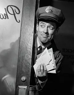 Mailman: Man mailman with handful of letter mail coming