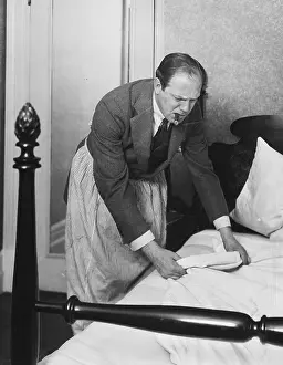 Valet: Man making bed