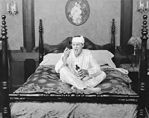 Disapproval: Man making a face while taking medicine