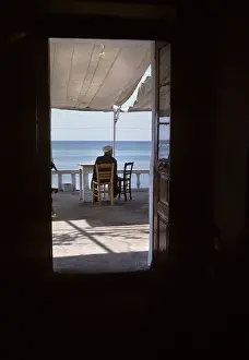 Thassos: Man in Mediterranean cafe, Thassos
