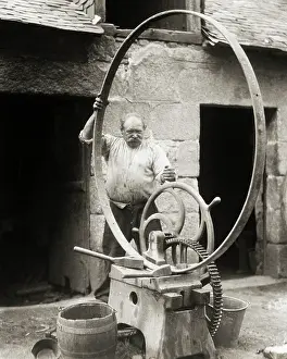 Reinforcing: Man Millwright or Blacksmith Bending Large Round