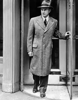 Topcoat: A man models a new topcoat for spring, March, ?