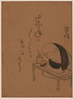 Meditating: A man or monk seated at a table, leaning on his arms, possib