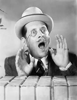 Scream: Man with a monocle looking surprised