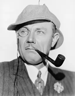 Deerstalker: Man with a monocle, pipe and a deerstalker hat