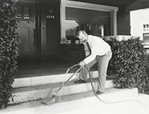 Improvise: Man moping his front stairs