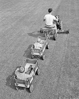 Solutions: Man Mowing Grass Driving Large Lawnmower