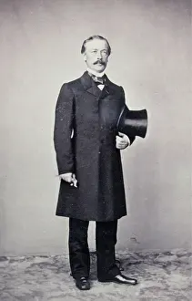 Bruxelles: Man with Mustache in a dark overcoat. The top