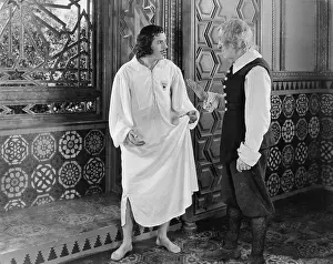 Knickerbockers: Man in a nightgown arguing with a man in the hallway