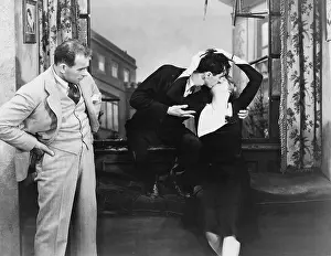 Intimacy: Man observing kissing couple