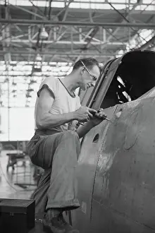 Riveting: Man - Occupations - Worker - WWII