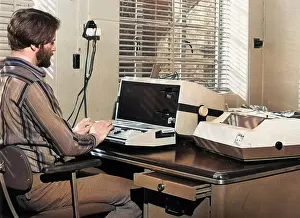 Processor: Man in an office with an Exidy Sorcerer computer