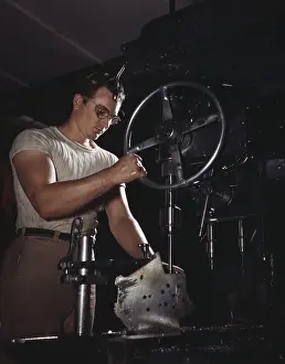 Aviations: Man operates a drill-press in the North ?