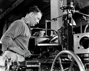 Machinist: Man Operating Industrial Lathe Machine