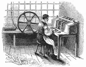 Sometimes: Man operating machine for punching cards for Jacquard