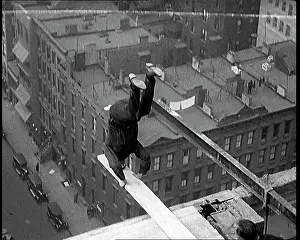 Plank: Man Performing Handstand on a Plank Suspended