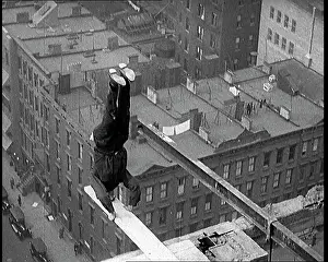 Plank: Man Performing Handstand on a Plank Suspended