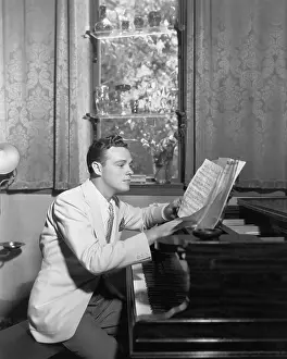 Pianists: Man at piano with sheet music