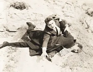 1910s 1940s: Man pinned to the ground during fight