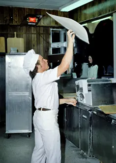 Pizzeria: Man a Pizza Maker Throwing Spinning Tossing Dough