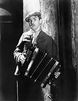 Nightfall: Man playing an accordion