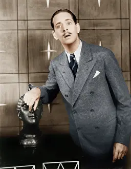 Mustaches: Man playing and doing silly things with a bust