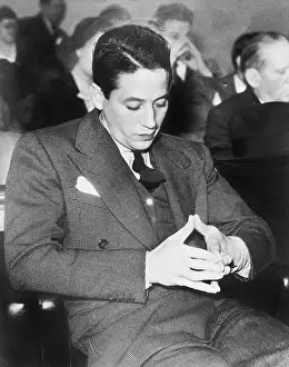 Drab: Man playing with his fingers sitting and waiting