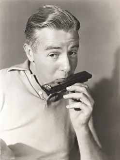 Ov1606: Man playing the harmonica