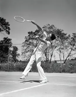 Esteem: Man Playing Tennis Swinging Racket
