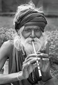 Hirsute: Man playing tin whistle, Agra, India - 2