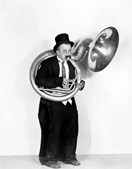 Showmanship: Man playing a tuba in a top hat