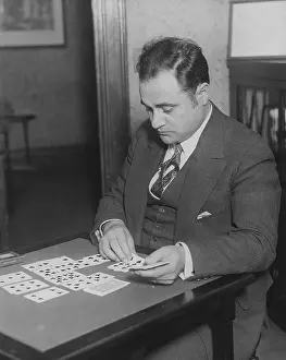 Solitaire: Man plays solitaire