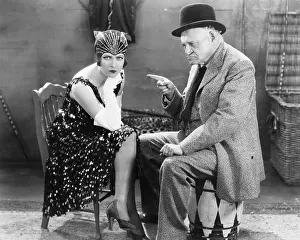 Angrily: Man pointing angrily at a young woman