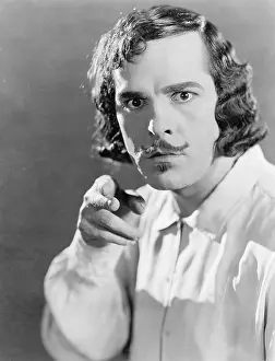 Mustaches: Man pointing with his finger and looking angry