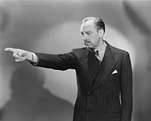 Glare: Man pointing finger in warning