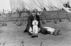Marquee: Man and poodle in a park