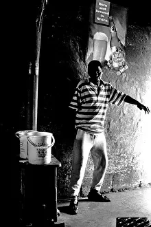 Migrate: Man poses for the camera in a shebeen in Dobsonville