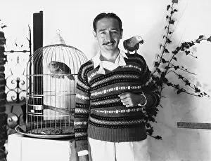 Mustaches: Man posing with pet birds