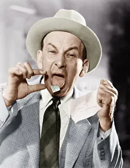 Envelopes: Man with a postage stamp stuck on his tongue