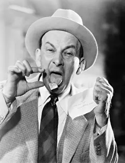 Envelopes: Man with a postage stamp stuck on his tongue