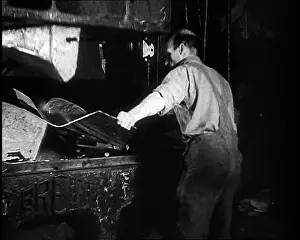 Pressing: A Man Pressing Metal