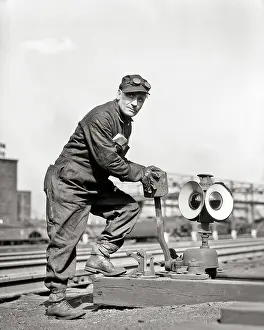 Manually: Man Railroad Worker Switchman looking at Camera