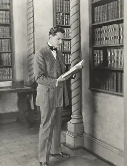Engrossed: Man reading library book