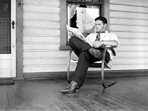 Aliquippa: Man - reading - newspaper - leisure activities