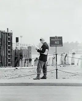 Trespassing: man - reading - newspaper - leisure activities